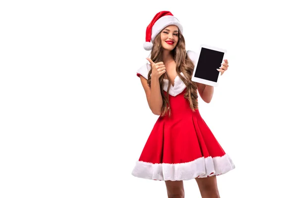 Happy Girl Santa Costume Presenting Tablet Showing Thumb Isolated White — Stock Photo, Image