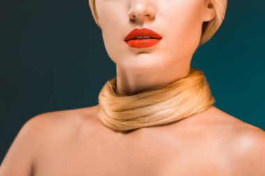 partial view of woman with red lips and blond hair over neck on dark backdrop clipart