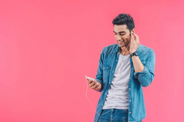 Portrait Smiling Man Smartphone Listening Music Earphones Isolated Pink — Stock Photo, Image