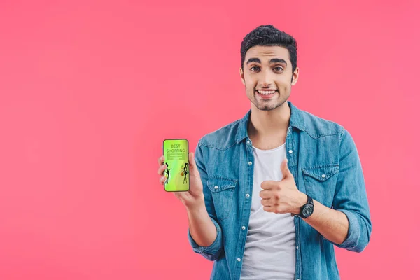 Smiling Young Man Doing Thumb Gesture Showing Smartphone Best Shopping — Stock Photo, Image