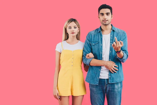 Handsome Young Man Showing Middle Finger While His Girlfriend Standing — Free Stock Photo