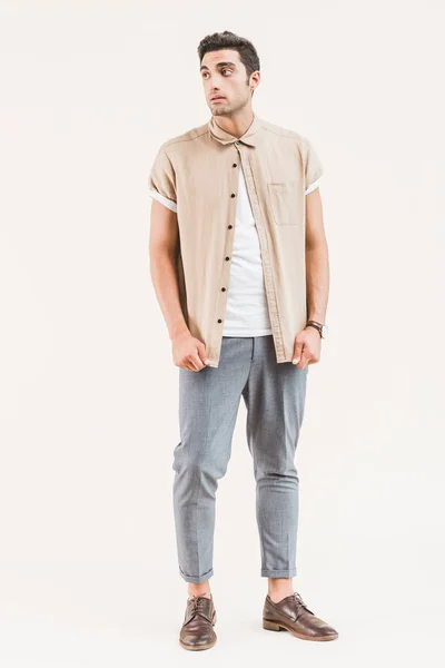 Serious Stylish Young Man Shirt Looking Away Isolated Beige — Free Stock Photo