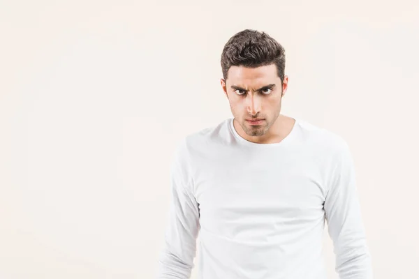 Aggressive Young Man Looking Camera Isolated Beige — Stock Photo, Image