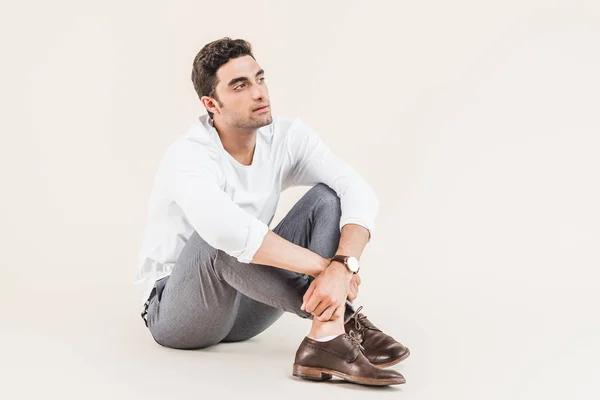 Full Length View Pensive Young Man Sitting Looking Away Isolated — Stock Photo, Image