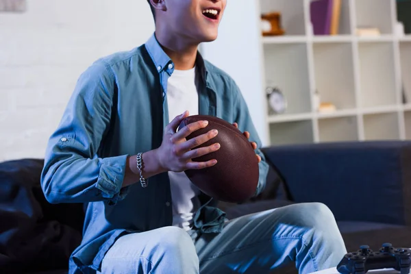 Cropped Shot Smiling Young Man Holding Rugby Ball Watching Sport — Free Stock Photo
