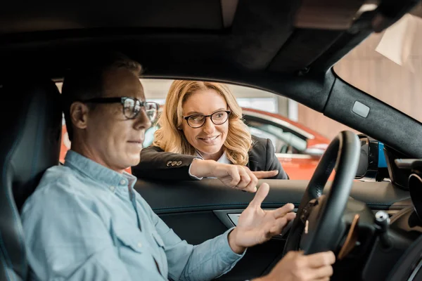 Handsome Adult Man Sitting Sport Car Showroom While Female Car — Stock Photo, Image