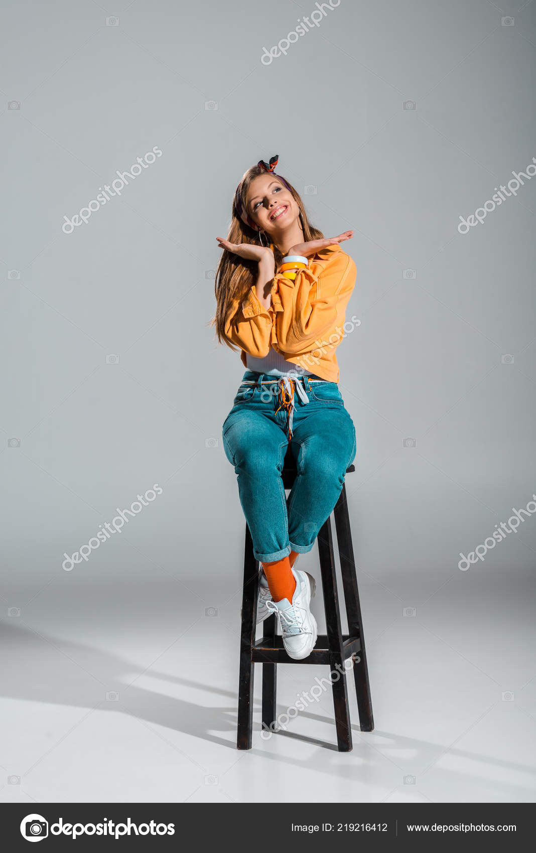 Attractive Cheerful Girl Posing Stool Grey Stock Photo by