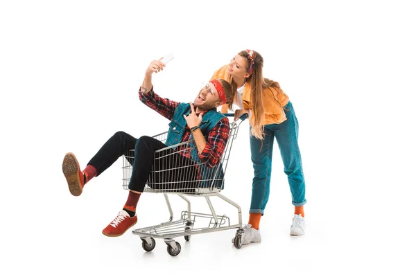 Male Hipster Shopping Cart Doing Rock Gesture Taking Selfie While — Free Stock Photo
