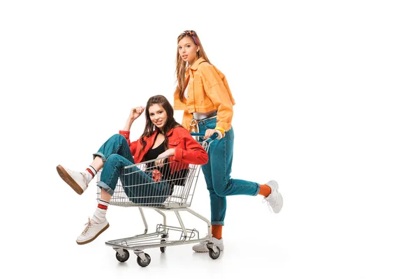 Happy Hipster Girls Having Fun Shopping Cart Isolated White — Stock Photo, Image
