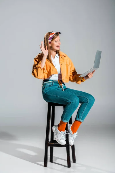 Attractive Cheerful Girl Waving Making Video Call Laptop Grey — Stock Photo, Image