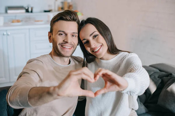 Beautiful Young Couple Making Heart Symbol Hands Looking Camera — Stock Photo, Image