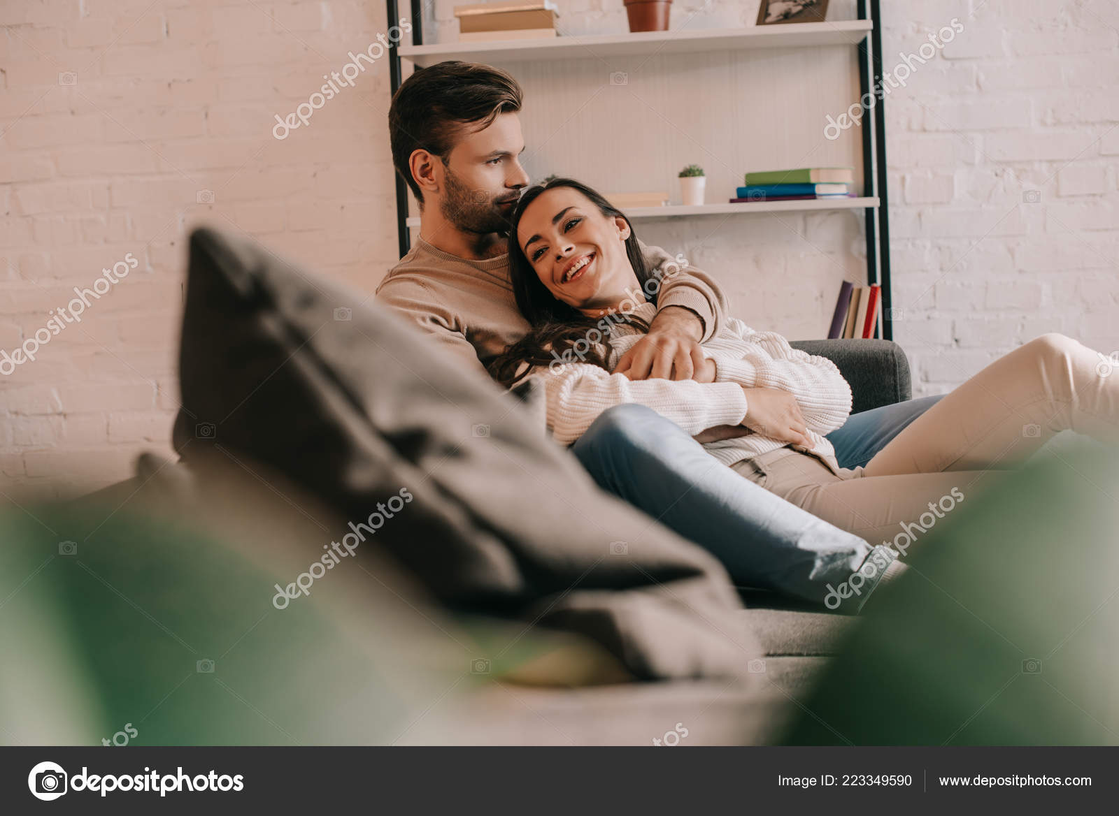 couple cuddling on couch