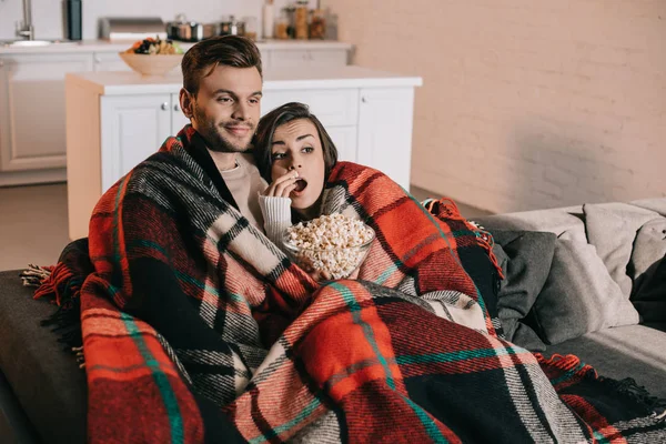 Beautiful Young Couple Watching Movie Popcorn Couch Covering Plaid — Stock Photo, Image