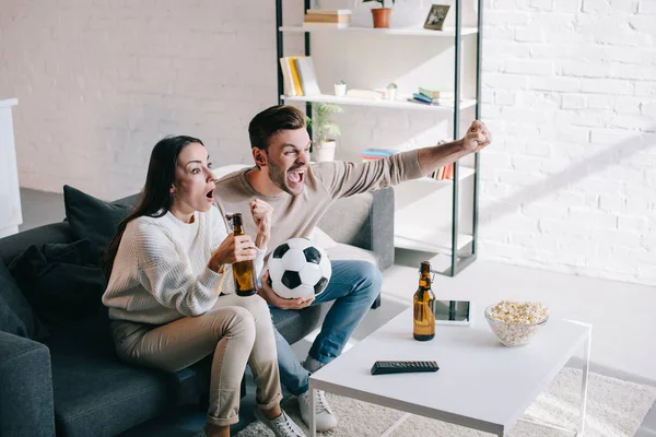 Emotional Young Couple Watching Football Game Home — Stock Photo, Image