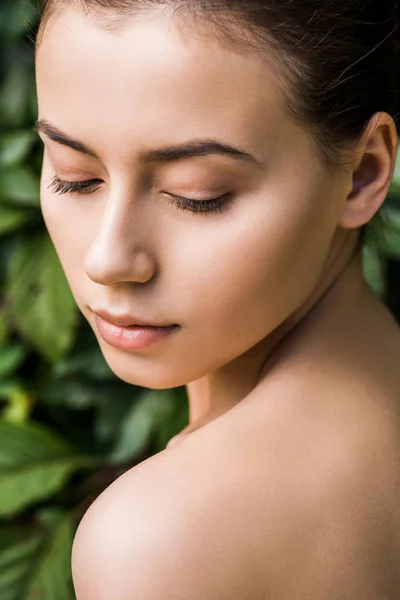 Young Woman Closed Eyes Green Leaves Background — Free Stock Photo