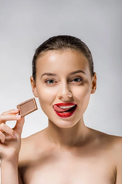 Young Beautiful Woman Red Lips Holding Chocolate Piece Licking Lips — Stock Photo, Image