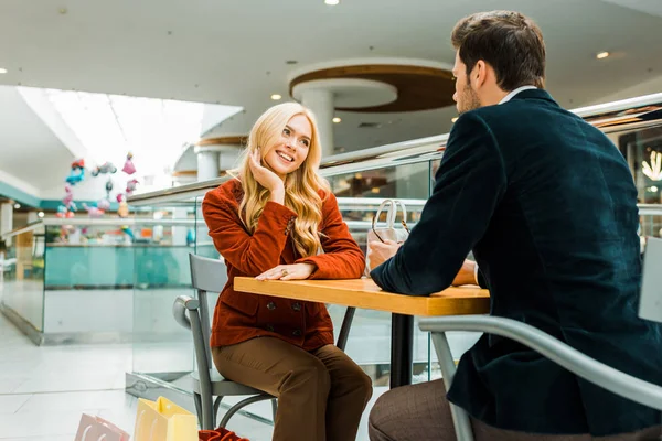 Happy Couple Looking Each Other Sitting Shopping Bags Cafe Mall — Stock Photo, Image