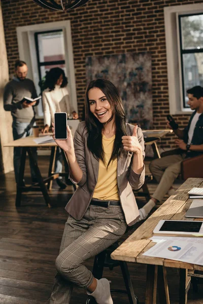 Casual Businesswoman Holding Smartphone Blank Screen Showing Thumbs Sign Loft — Stock Photo, Image