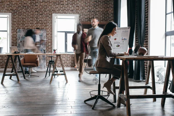 Casual Businesswoman Working Desk Colleagues Motion Blur Modern Loft Office — Stock Photo, Image