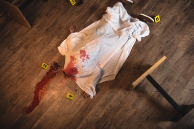 top view dead body covered with white sheet at crime scene clipart