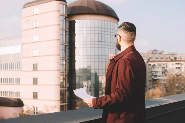 Adult Male Architect Holding Blueprint Looking Beautiful View Rooftop — Free Stock Photo