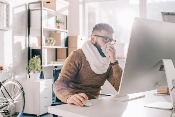 Sick Businessman Knitted Scarf Sitting Office Sneezing Covering Mouth Tissue — Stock Photo, Image