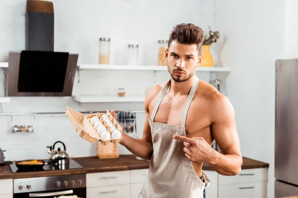 Sexy Bare Chested Man Apron Pointing Finger Egg Carton — Stock Photo, Image