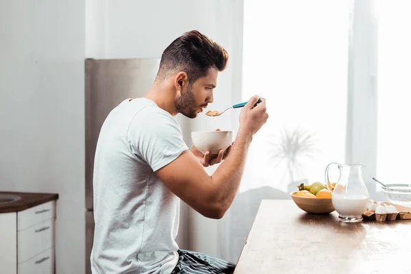 Side View Young Man Pajamas Eating Cereals Breakfast Home — Stock Photo, Image