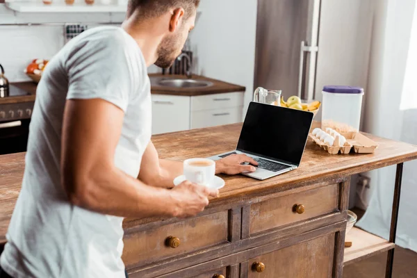 Cropped Shot Young Man Holding Cup Coffee Using Laptop Blank — Stock Photo, Image