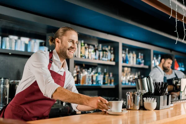 Handsome Smiling Barista Apron Serving Coffee Wooden Counter — Stock Photo, Image