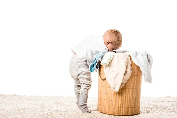 Toddler Boy Looking Wicker Laundry Basket Carpet Isolated White — Stock Photo, Image