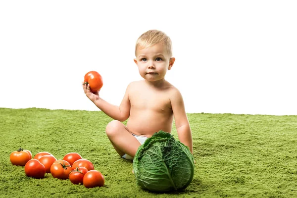 Toddler Boy Holding Tomato Sitting Green Carpet Vegetables Isolated White — Free Stock Photo
