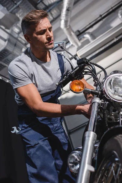 Handsome Adult Mechanic Overalls Fixing Motorcycle Garage — Stock Photo, Image