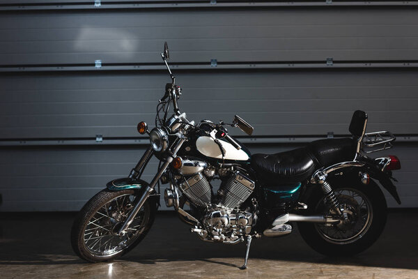 side view of motorbike on floor in garage