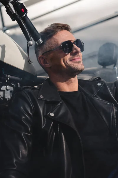 Handsome Motorbiker Black Sunglasses Smiling Sitting Motorbike Garage — Free Stock Photo