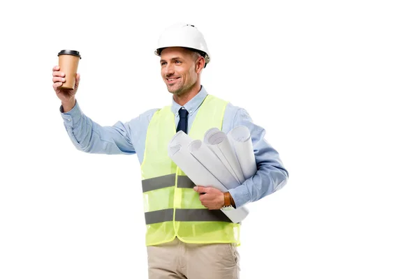 微笑的工程师在安全背心持有蓝图和咖啡去孤立的白色 — 图库照片