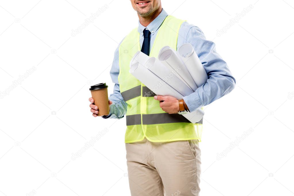 partial view of engineer holding blueprints and coffee to go isolated on white