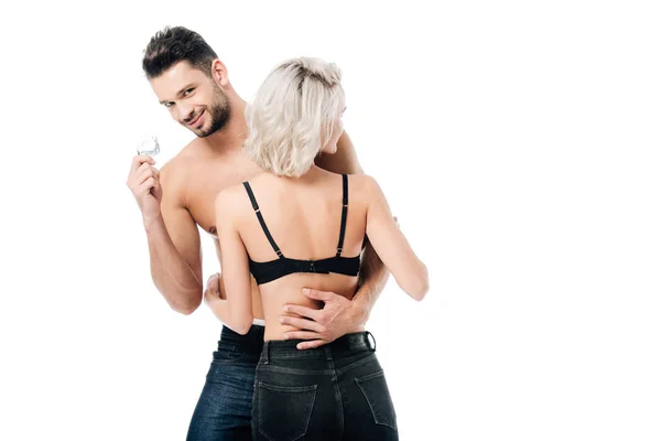 Smiling Man Hugging Woman Looking Camera Holding Condom Isolated White — Stock Photo, Image