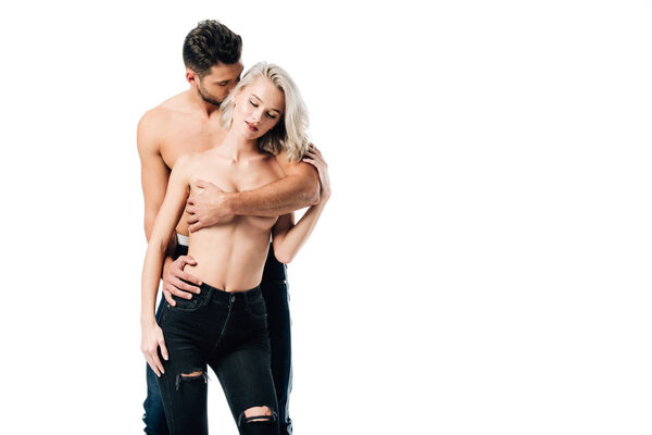 man holding attractive topless woman in passionate embrace isolated on white