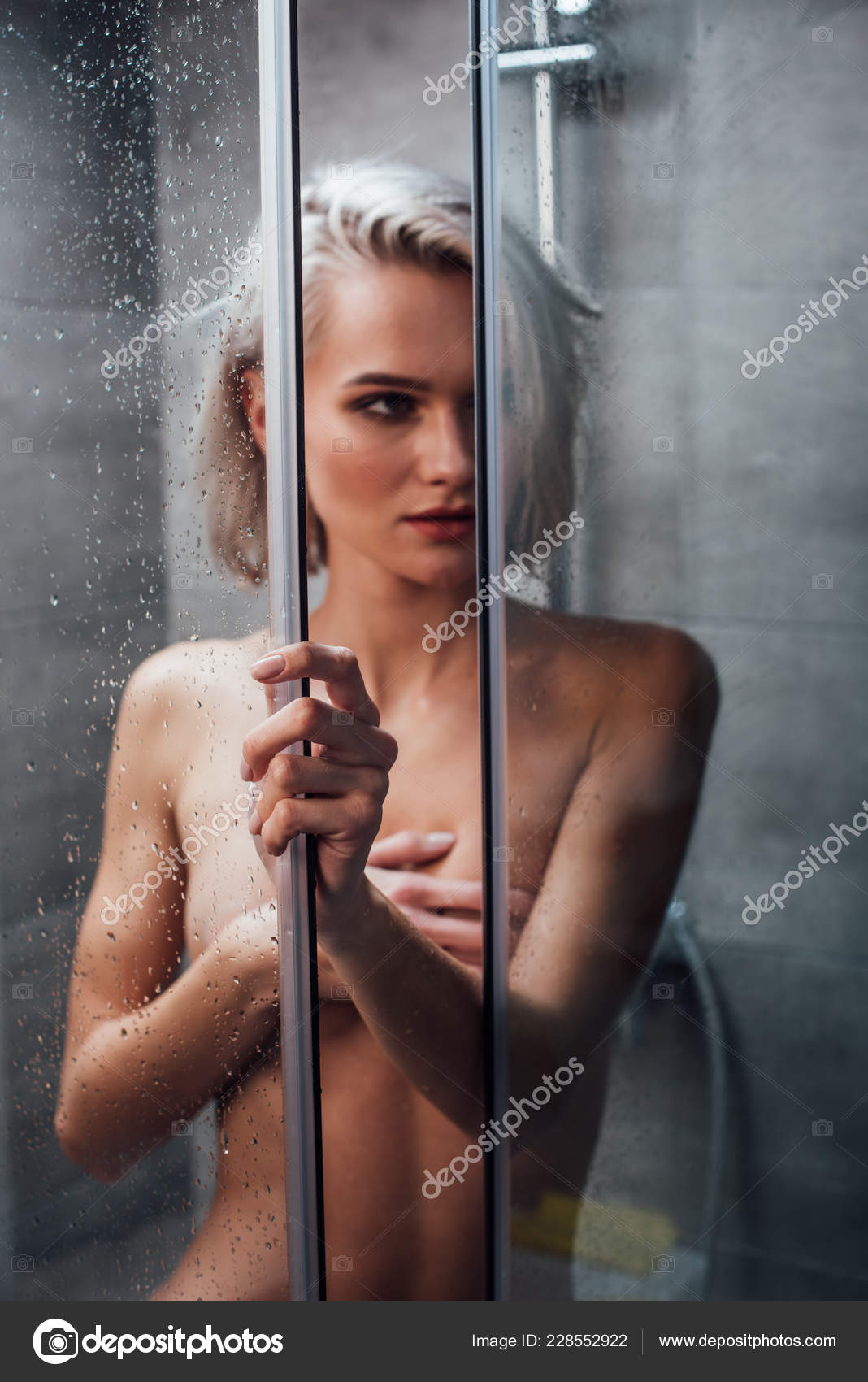 Naked Sensual Woman Holding Shower Door Looking Away Posing