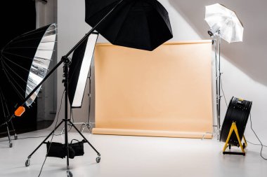 professional photo and lighting equipment in empty photo studio