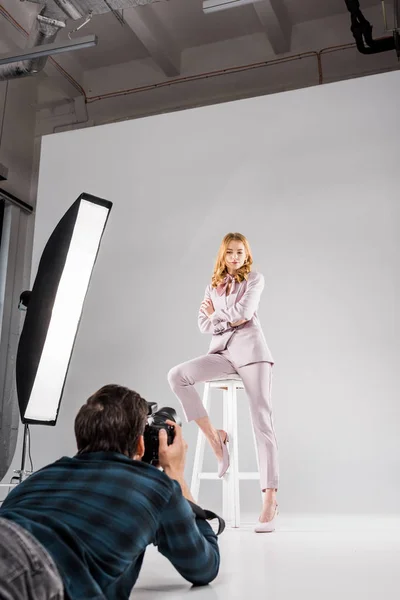 Photographer Camera Lying Photographing Beautiful Female Model Posing Studio — Stock Photo, Image