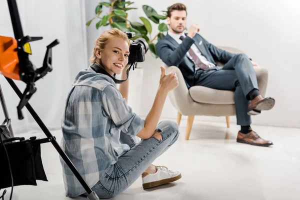 Happy Young Photographer Smiling Camera Showing Thumb While Male Model — Stock Photo, Image