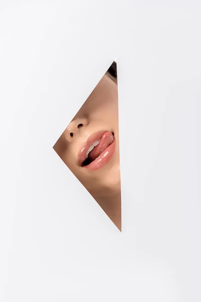 Cropped Shot Girl Licking Lips Hole White — Free Stock Photo