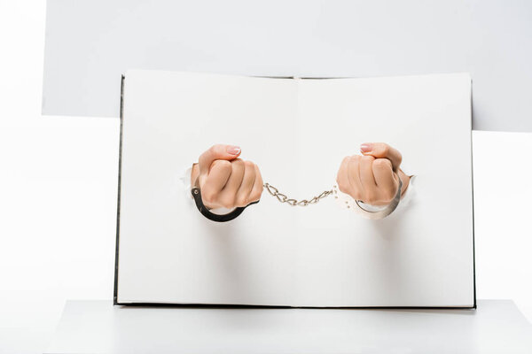 Cropped Shot Female Hand Handcuffs Holes White — Stock Photo, Image