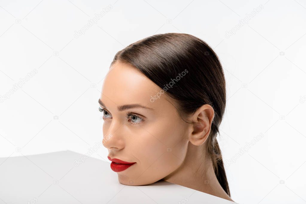 beautiful young woman with red lips looking away isolated on white