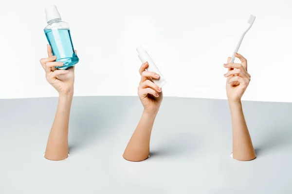 Cropped Shot Women Holding Toothpaste Toothbrush Mouthwash Holes White — Stock Photo, Image