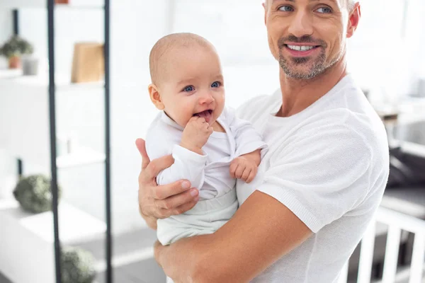 Happy Father Holding Cheerful Baby Home — Stock Photo, Image