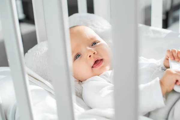 Happy Infant Kid Lying White Baby Crib — Stock Photo, Image