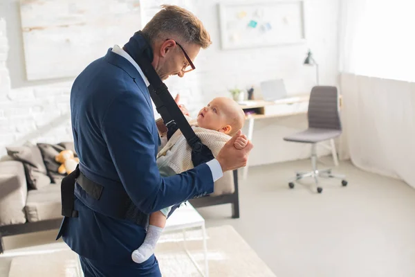 Cheerful Businessman Holding Hands Infant Daughter Baby Carrier — Stock Photo, Image